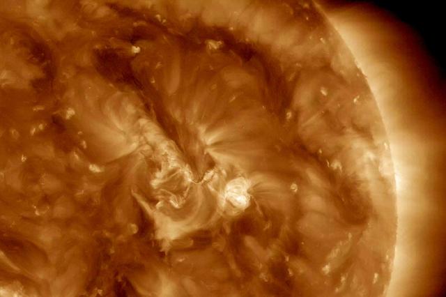 A minor solar eruption triggered a crackling, white flash that sent an expanding wave of plasma below it over about six hours (Nov. 4, 2016). Some of the plasma also appeared to surge along a narrow path above the active region as well. Such occurrences are fairly common, but still interesting to watch up close. The images were taken in a wavelength of extreme ultraviolet light.  Movies are available at http://photojournal.jpl.nasa.gov/catalog/PIA21202