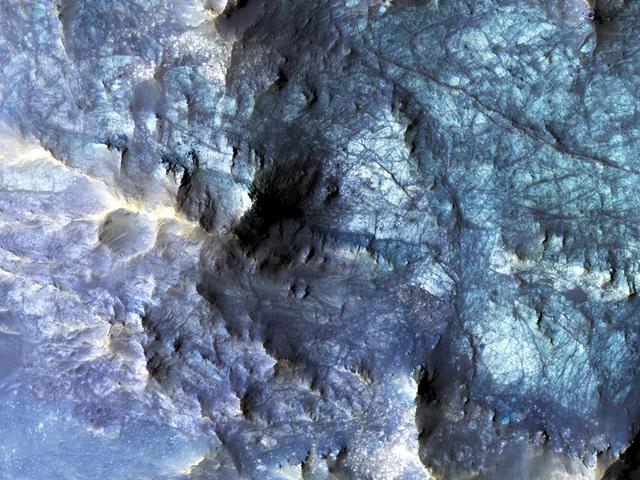 NASA image: Exposed Fractured Bedrock in the Central Pit of a Crater