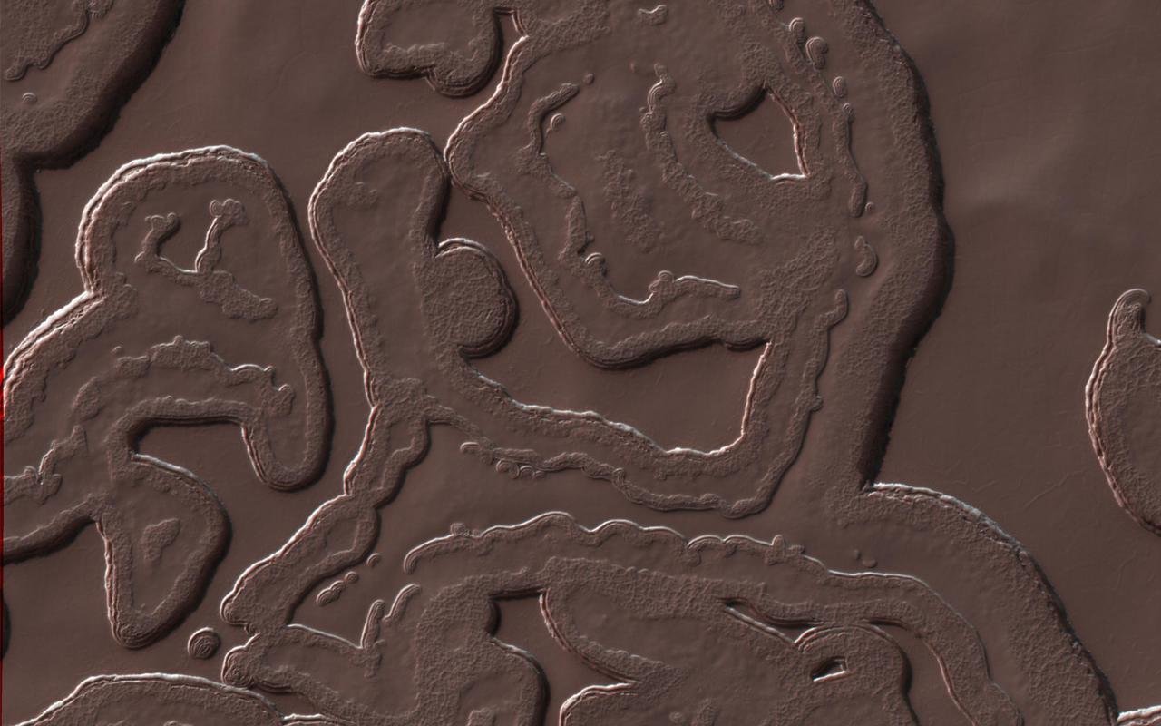 Many Martian landscapes contain features that are familiar to ones we find on Earth, like river valleys, cliffs, glaciers and volcanos.  However, Mars has an exotic side too, with landscapes that are alien to Earthlings. This image shows one of these exotic locales at the South Pole. The polar cap is made from carbon dioxide (dry ice), which does not occur naturally on the Earth. The circular pits are holes in this dry ice layer that expand by a few meters each Martian year.  New dry ice is constantly being added to this landscape by freezing directly out of the carbon dioxide atmosphere or falling as snow. Freezing out the atmosphere like this limits how cold the surface can get to the frost point at -130 degrees Celsius (-200 F). Nowhere on Mars can ever get any colder this, making this this coolest landscape on Earth and Mars combined.  http://photojournal.jpl.nasa.gov/catalog/PIA21216
