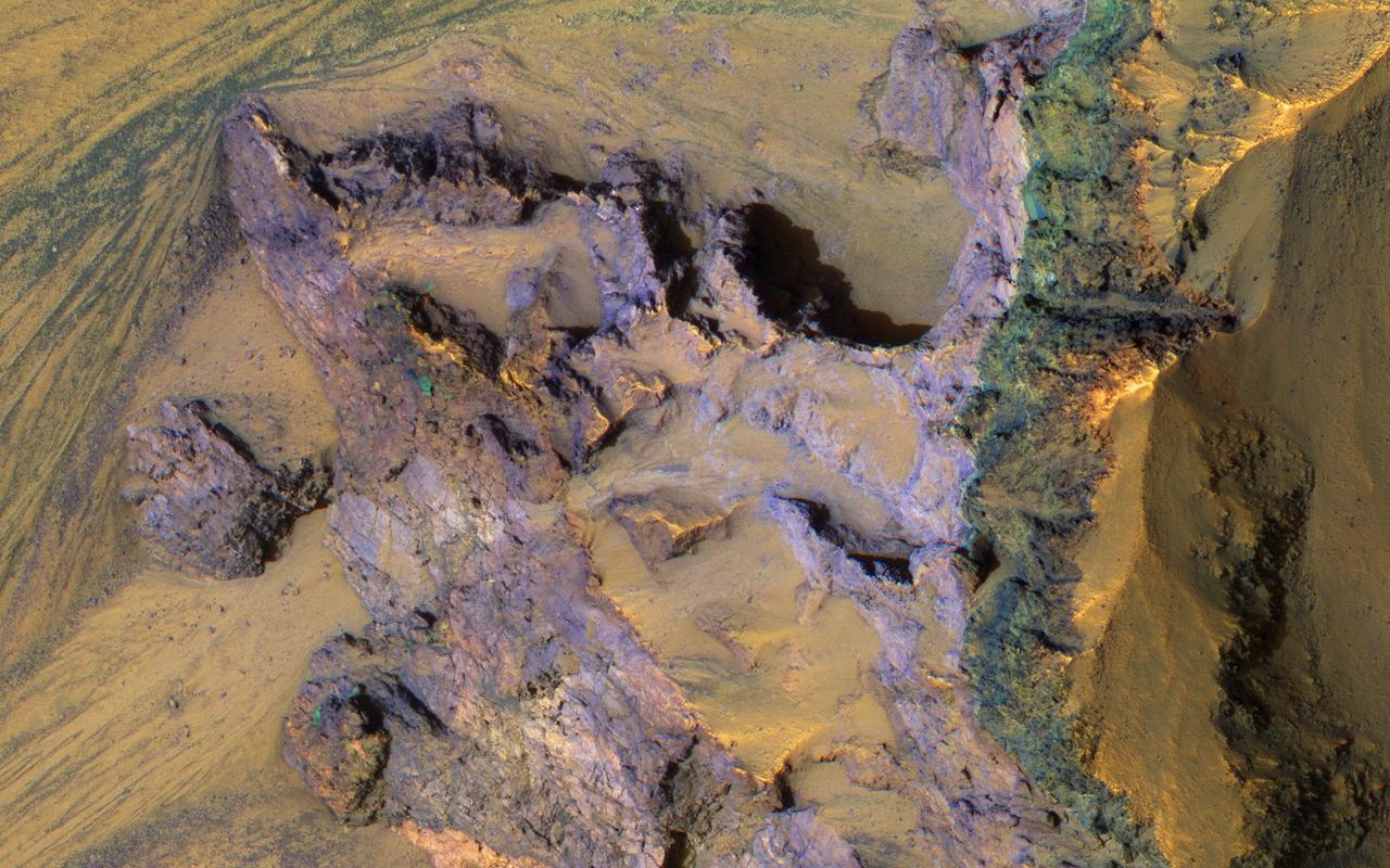 The steep walls of Valles Marineris sometimes fail, creating giant landslides. This provides a clean exposure of the underlying bedrock.  This image of the north wall of Ganges Chasma reveals bedrock with diverse colors and textures, representing different geologic units.   http://photojournal.jpl.nasa.gov/catalog/PIA21217