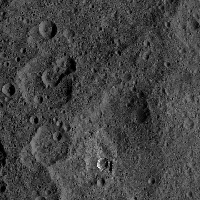 The small, bright crater Oxo on Ceres is featured in this image from NASA's Dawn spacecraft. Oxo (6 miles, 10 kilometers in diameter) is located at mid-latitudes on Ceres and likely has water ice.  Dawn took this image on Oct. 17, 2016, from its second extended-mission science orbit, at a distance of about 920 miles (1,480 kilometers) above the surface. The image resolution is about 460 feet (140 meters) per pixel.  http://photojournal.jpl.nasa.gov/catalog/PIA21221
