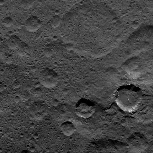Relatively young craters, with sharp crater rims and streaks of bright material, are the focus of this view of Ceres from NASA's Dawn spacecraft. The large, ancient and quite degraded crater Fluusa is seen at top center. The younger craters are Kupalo, at lower right, and Juling, to its left.  Dawn took this image on Oct. 17, 2016, from its second extended-mission science orbit (XMO2), at a distance of about 920 miles (1,480 kilometers) above the surface. The image resolution is about 460 feet (140 meters) per pxel.  http://photojournal.jpl.nasa.gov/catalog/PIA21223