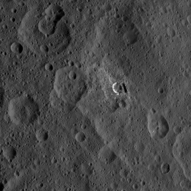 Oxo Crater and its surroundings are featured in this image of Ceres' surface from NASA's Dawn spacecraft.  Dawn took this image on Oct. 18, 2016, from its second extended-mission science orbit (XMO2), at a distance of about 920 miles (1,480 kilometers) above the surface. The image resolution is about 460 feet (140 meters) per pixel.  http://photojournal.jpl.nasa.gov/catalog/PIA21225