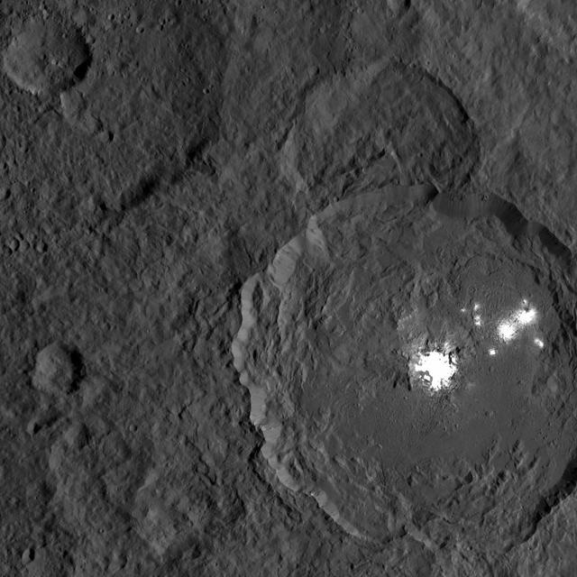 This image from NASA's Dawn spacecraft shows Occator Crater on Ceres, with its signature bright areas. Dawn scientists have found that the central bright spot, which harbors the brightest material on Ceres, contains a variety of salts. The brightest parts of these features are overexposed in this image, which had an exposure time intended to capture details in the surrounding terrain. Shorter exposures allow details within the brightest areas to be seen, as in PIA20653. Dawn took this image on Oct. 18, 2016, from its second extended-mission science orbit (XMO2), at a distance of about 920 miles (1,480 kilometers) above the surface. The image resolution is about 460 feet (140 meters) per pixel. http://photojournal.jpl.nasa.gov/catalog/PIA21227