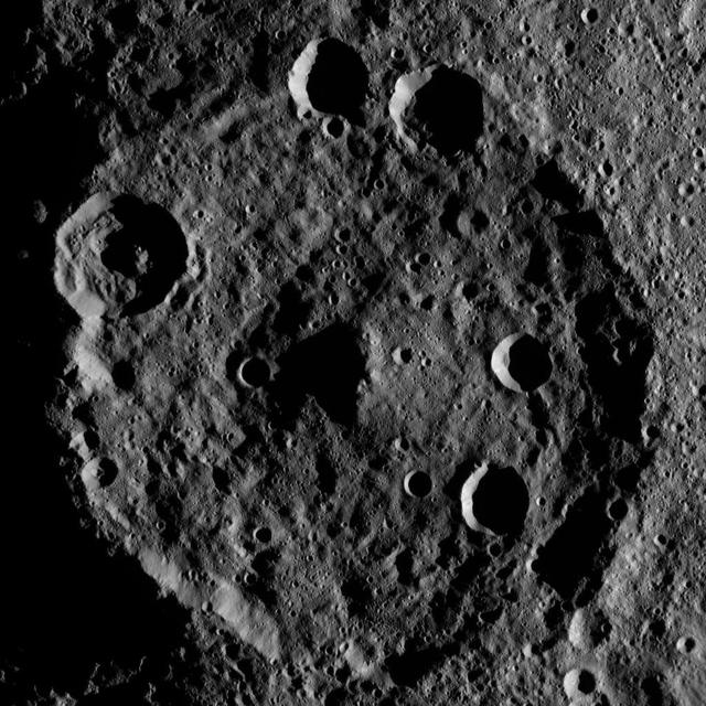 Zadeni Crater on Ceres is featured in this image from NASA's Dawn spacecraft. This large southern-hemisphere crater is 79.5 miles (128 kilometers) in diameter and is named for an ancient Georgian god of bountiful harvest. Dawn took this image on Oct. 19 from its second extended-mission science orbit (XMO2), at a distance of about 920 miles (1,480 kilometers) above the surface. The image resolution is about 460 feet (140 meters) per pixel. http://photojournal.jpl.nasa.gov/catalog/PIA21229
