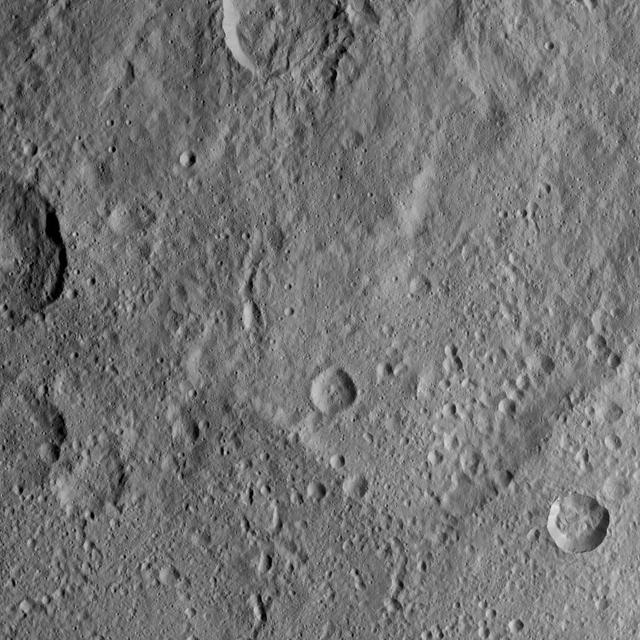 This scene from Ceres features terrain near the rim of the large crater named Kerwan, at lower left. At 174 miles (280 kilometers) in diameter, Kerwan is the largest crater that Dawn has discovered on Ceres. A much smaller, fresher crater called Cacaguat is seen in the lower right corner. Cacaguat, named for the Nicaraguan god of cacao, is 8.5 miles (13.6 kilometers) in diameter. Dawn took this image on Oct. 20, 2016, from its second extended-mission science orbit (XMO2), at a distance of about 920 miles (1,480 kilometers) above the surface. The image resolution is about 460 feet (140 meters) per pixel. http://photojournal.jpl.nasa.gov/catalog/PIA21241