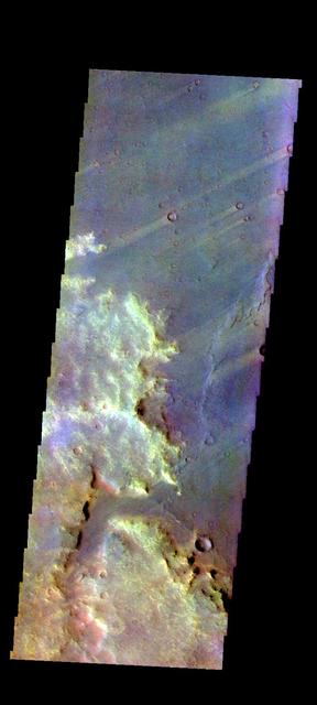 The THEMIS VIS camera contains 5 filters. The data from different filters can be combined in multiple ways to create a false color image. These false color images may reveal subtle variations of the surface not easily identified in a single band image. Today's false color image shows several wind streaks in Syrtis Major Planum. Orbit Number: 50693 Latitude: -0.448856 Longitude: 68.374 Instrument: VIS Captured: 2013-05-19 02:56 http://photojournal.jpl.nasa.gov/catalog/PIA21278