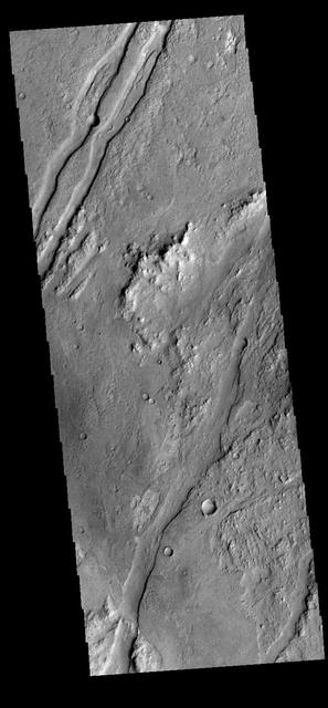 This image captured by NASA 2001 Mars Odyssey spacecraft shows graben called Claritas Fossae. Orbit Number: 66332 Latitude: -35.5437 Longitude: 251.308 Instrument: VIS Captured: 2016-11-26 15:54 http://photojournal.jpl.nasa.gov/catalog/PIA21288
