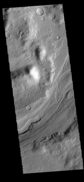 This image captured by NASA 2001 Mars Odyssey spacecraft shows a small portion of Reull Vallis.  Reull Vallis is one of the major channels entering eastern Hellas Planitia.  Orbit Number: 66499 Latitude: -39.1457 Longitude: 111.246 Instrument: VIS Captured: 2016-12-10 10:06  http://photojournal.jpl.nasa.gov/catalog/PIA21298