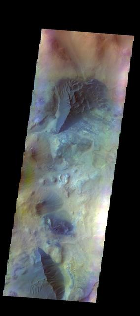 The THEMIS camera contains 5 filters. Data from different filters can be combined in multiple ways to create a false color image. These false color images may reveal subtle variations of the surface not easily identified in a single band image. Today's false color image shows several areas of dunes and sand sheets with dune forms between the numerous hills in this region west of Argyre Planitia. Basaltic sand appears dark blue in this false color image. Orbit Number: 51285 Latitude: -47.6247 Longitude: 303.752 Instrument: VIS Captured: 2013-07-06 18:21 http://photojournal.jpl.nasa.gov/catalog/PIA21306