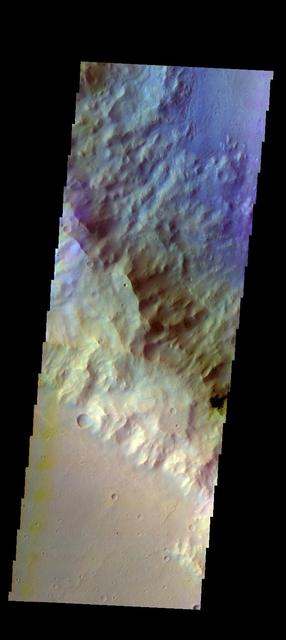 The THEMIS VIS camera contains 5 filters. The data from different filters can be combined in multiple ways to create a false color image. These false color images may reveal subtle variations of the surface not easily identified in a single band image. Today's false color image shows part of the southwestern rim of Knobel Crater. Knobel Crater is located in Terra Cimmeria. Orbit Number: 52003 Latitude: -7.25713 Longitude: 132.523 Instrument: VIS Captured: 2013-09-03 20:02 http://photojournal.jpl.nasa.gov/catalog/PIA21314