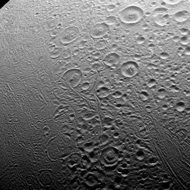 In the north, Enceladus' surface appears to be about as old as any in the solar system. The south, however, is an entirely different story.  The north polar area of Enceladus (313 miles or 504 kilometers across) seen here is heavily cratered, an indication that the surface has not been renewed since quite long ago. But the south polar region shows signs of intense geologic activity, most prominently focused around the long fractures known as "tiger stripes" that spray gas and tiny particles from the moon.  This view looks toward the leading side of Enceladus. North on Enceladus is up and rotated 38 degrees to the left. The image was taken in visible light with the Cassini spacecraft narrow-angle camera on Nov. 27, 2016.  The view was acquired at a distance of approximately 20,000 miles (32,000 kilometers) from Enceladus and at a Sun-Enceladus-spacecraft, or phase, angle of 85 degrees. Image scale is 620 feet (190 meters) per pixel.   https://photojournal.jpl.nasa.gov/catalog/PIA21326