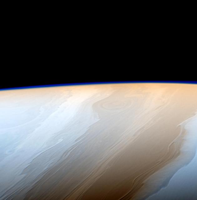 Clouds on Saturn take on the appearance of strokes from a cosmic brush thanks to the wavy way that fluids interact in Saturn's atmosphere.  Neighboring bands of clouds move at different speeds and directions depending on their latitudes. This generates turbulence where bands meet and leads to the wavy structure along the interfaces. Saturn's upper atmosphere generates the faint haze seen along the limb of the planet in this image.  This false color view is centered on 46 degrees north latitude on Saturn. The images were taken with the Cassini spacecraft narrow-angle camera on May 18, 2017 using a combination of spectral filters which preferentially admit wavelengths of near-infrared light. The image filter centered at 727 nanometers was used for red in this image; the filter centered at 750 nanometers was used for blue. (The green color channel was simulated using an average of the two filters.)  The view was obtained at a distance of approximately 750,000 miles (1.2 million kilometers) from Saturn. Image scale is about 4 miles (7 kilometers) per pixel.   https://photojournal.jpl.nasa.gov/catalog/PIA21341