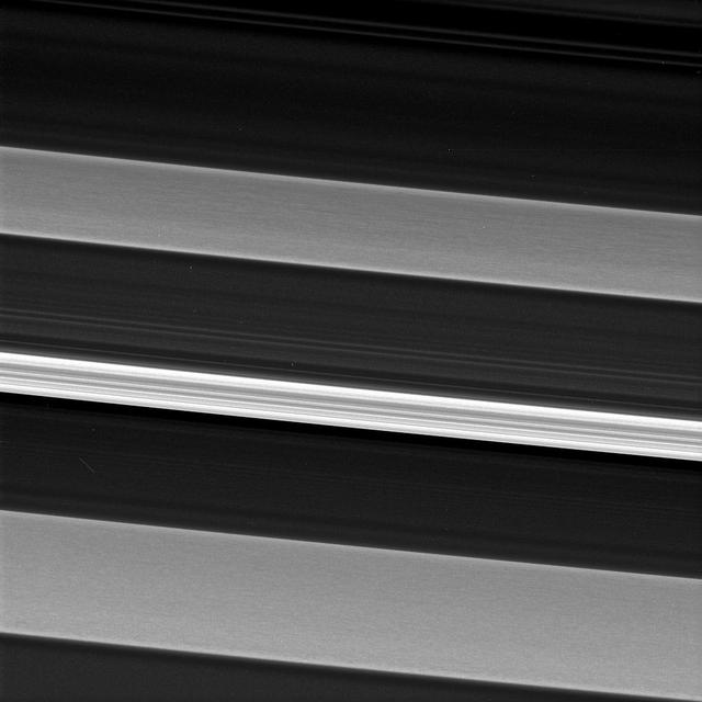Saturn's C ring is home to a surprisingly rich array of structures and textures. Much of the structure seen in the outer portions of Saturn's rings is the result of gravitational perturbations on ring particles by moons of Saturn.  Such interactions are called resonances. However, scientists are not clear as to the origin of the structures seen in this image which has captured an inner ring region sparsely populated with particles, making interactions between ring particles rare, and with few satellite resonances.  In this image, a bright and narrow ringlet located toward the outer edge of the C ring is flanked by two broader features called plateaus, each about 100 miles (160 kilometers) wide.  Plateaus are unique to the C ring. Cassini data indicates that the plateaus do not necessarily contain more ring material than the C ring at large, but the ring particles in the plateaus may be smaller, enhancing their brightness. This view looks toward the sunlit side of the rings from about 53 degrees above the ring plane. The image was taken in green light with the Cassini spacecraft narrow-angle camera on Aug. 14, 2017.  The view was acquired at a distance of approximately 117,000 miles (189,000 kilometers) from Saturn and at a Sun-Saturn-spacecraft, or phase, angle of 74 degrees. Image scale is 3,000 feet (1 kilometer) per pixel.   The Cassini spacecraft ended its mission on Sept. 15, 2017.  https://photojournal.jpl.nasa.gov/catalog/PIA21356