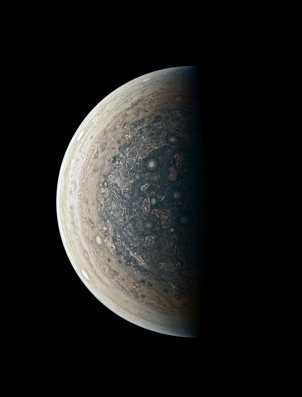 This enhanced-color image of Jupiter's south pole and its swirling atmosphere was created by citizen scientist Roman Tkachenko using data from the JunoCam imager on NASA's Juno spacecraft.  Juno acquired the image, looking directly at the Jovian south pole, on February 2, 2017, at 6:06 a.m. PST (9:06 a.m. EST) from an altitude of about 63,400 miles (102,100 kilometers) above Jupiter's cloud tops. Cyclones swirl around the south pole, and white oval storms can be seen near the limb -- the apparent edge of the planet.  http://photojournal.jpl.nasa.gov/catalog/PIA21381