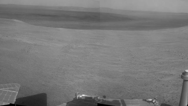 "Perseverance Valley" lies just on the other side of the dip in the crater rim visible in the left half of this 360-degree panorama from the Navigation Camera (Navcam) on NASA's Mars Exploration Rover Opportunity.  As the rover arrived at this area in early May 2017, researchers began looking for clues about what process carved the valley. The rover team plans to drive Opportunity all the way down the valley into the interior of Endeavour Crater.  The foreground and the area to the right are on the plain just outside of Endeavour Crater.  The high point near the center of the image is called "Winnemucca," part of an Endeavour rim segment called "Cape Byron." Endeavour's interior and distant eastern rim are visible at upper left, above the notched portion of the western rim that sits directly above Perseverance Valley.  The rover's Navcam took the component images of this scene on May 2 and May 3, 2017, during the 4,718th and 4,719th Martian days, or sols, of Opportunity's work on Mars, two days before a drive that brought Opportunity to the head of the valley.   https://photojournal.jpl.nasa.gov/catalog/PIA21495