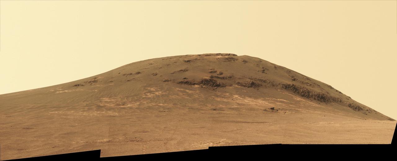NASA's Mars Exploration Rover Opportunity worked for 30 months on a raised segment of Endeavour Crater's rim called "Cape Tribulation" until departing that segment in mid-April 2017, southbound toward a new destination. This view looks back at the southern end of Cape Tribulation from about two football fields' distance away. The component images were taken by the rover's Panoramic Camera (Pancam) on April 21, during the 4,707th Martian day, or sol, of Opportunity's mission on Mars. Wheel tracks can be traced back to see the rover's route as it descended and departed Cape Tribulation. For scale, the distance between the two parallel tracks is about 3.3 feet (1 meter). The rover drove from the foot of Cape Tribulation to the head of "Perseverance Valley" in seven drives totaling about one-fifth of a mile (one-third of a kilometer). The elevation difference between the highest point visible in this scene and the rover's location when the images were taken is about 180 feet (55 meters). This view looks northward. It merges exposures taken through three of the Pancam's color filters, centered on wavelengths of 753 nanometers (near-infrared), 535 nanometers (green) and 432 nanometers (violet). It is presented in approximately true color. https://photojournal.jpl.nasa.gov/catalog/PIA21497