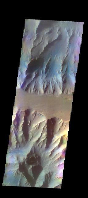 The THEMIS VIS camera contains 5 filters. The data from different filters can be combined in multiple ways to create a false color image. These false color images may reveal subtle variations of the surface not easily identified in a single band image. Today's false color image shows part of Coprates Chasma. Orbit Number: 52272 Latitude: -13.5675 Longitude: 297.001 Instrument: VIS Captured: 2013-09-25 23:18 http://photojournal.jpl.nasa.gov/catalog/PIA21515