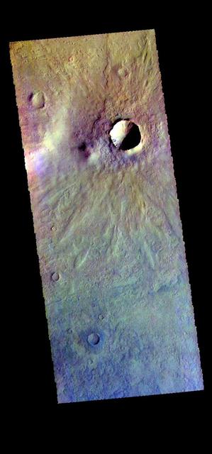 The THEMIS camera contains 5 filters. The data from different filters can be combined in multiple ways to create a false color image. These false color images may reveal subtle variations of the surface not easily identified in a single band image. This false color image from NASA 2001 Mars Odyssey spacecraft shows several small craters in Aonia Terra. Orbit Number: 58048 Latitude: -48.2615 Longitude: 242.373 Instrument: VIS Captured: 2015-01-14 09:42 https://photojournal.jpl.nasa.gov/catalog/PIA21541