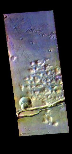 The THEMIS camera contains 5 filters. The data from different filters can be combined in multiple ways to create a false color image. hese false color images may reveal subtle variations of the surface not easily identified in a single band image. This image from NASA 2001 Mars Odyssey spacecraft shows part of Gorgonum Chaos. The linear depression at the bottom of the image are part of Sirenum Fossae. Gorgonum Chaos is located in Terra Sirenum. Orbit Number: 58237 Latitude: -38.0276 Longitude: 188.624 Instrument: VIS Captured: 2015-01-29 23:14 https://photojournal.jpl.nasa.gov/catalog/PIA21545
