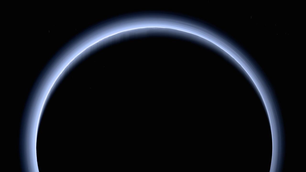 This is the highest-resolution color departure shot of Pluto's receding crescent from NASA's New Horizons spacecraft, taken when the spacecraft was 120,000 miles (200,000 kilometers) away from Pluto. Shown in approximate true color, the picture was constructed from a mosaic of six black-and-white images from the Long Range Reconnaissance Imager (LORRI), with color added from a lower resolution Ralph/Multispectral Visible Imaging Camera (MVIC) color image, all acquired between 15:20 and 15:45 UT -- about 3.5 hours after closest approach to Pluto -- on July 14, 2015. The resolution of the LORRI images is about 0.6 miles (1 kilometer) per pixel; the sun illuminates the scene from the other side of Pluto and somewhat toward the top of this image. The image is dominated by spectacular layers of blue haze in Pluto's atmosphere. Scientists believe the haze is a photochemical smog resulting from the action of sunlight on methane and other molecules in Pluto's atmosphere, producing a complex mixture of hydrocarbons such as acetylene and ethylene. These hydrocarbons accumulate into small haze particles, a fraction of a micrometer in size, which preferentially scatter blue sunlight -- the same process that can make haze appear bluish on Earth. As they settle down through the atmosphere, the haze particles form numerous intricate, horizontal layers, some extending for hundreds of miles around large portions of the limb of Pluto. The haze layers extend to altitudes of over 120 miles (200 kilometers). Pluto's circumference is 4,667 miles (7,466 kilometers). Adding to the beauty of this picture are mountains and other topographic features on Pluto's surface that are silhouetted against the haze near the top of the image. Sunlight casts dramatic and beautiful finger-like shadows from many of these features onto the haze (especially on the left, near the 11 o'clock position), forming crepuscular rays like those often seen in Earth's atmosphere near sunrise or sunset. https://photojournal.jpl.nasa.gov/catalog/PIA21590