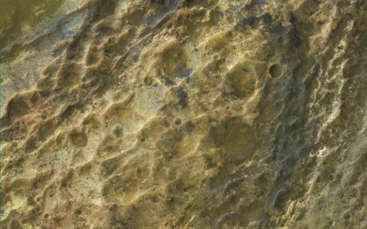 This image captured by NASA Mars Reconnaissance Orbiter MRO covers diverse surface units on the floor of eastern Coprates Chasma in eastern Valles Marineris. The bedrock has diverse minerals producing wonderful color contrasts. In over 10 years of orbiting Mars, HiRISE has acquired nearly 50,000 large images, but they cover less than 3 percent of the Martian surface.  https://photojournal.jpl.nasa.gov/catalog/PIA21606