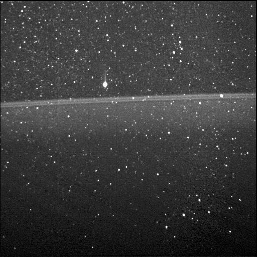 As NASA's Juno spacecraft flew through the narrow gap between Jupiter's radiation belts and the planet during its first science flyby, Perijove 1, on August 27, 2016, the Stellar Reference Unit (SRU-1) star camera collected the first image of Jupiter's ring taken from the inside looking out. The bright bands in the center of the image are the main ring of Jupiter's ring system.  While taking the ring image, the SRU was viewing the constellation Orion. The bright star above the main ring is Betelgeuse, and Orion's belt can be seen in the lower right. Juno's Radiation Monitoring Investigation actively retrieves and analyzes the noise signatures from penetrating radiation in the images of the spacecraft's star cameras and science instruments at Jupiter.  https://photojournal.jpl.nasa.gov/catalog/PIA21644