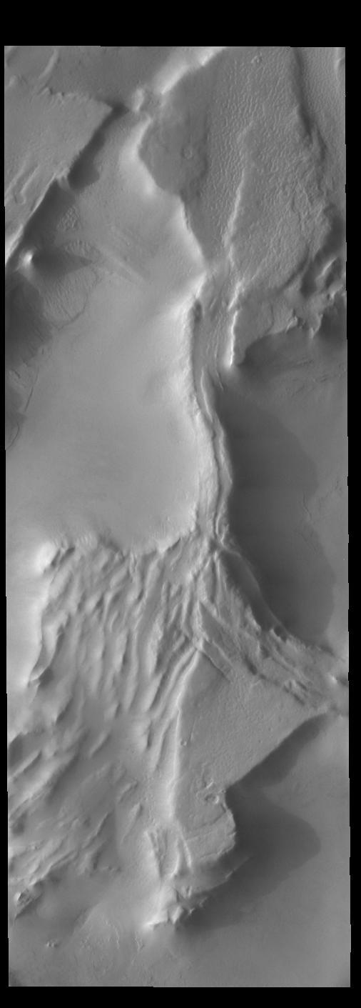 The ridges in this VIS image are creating shadows due to low sun angle. Shadows can give indications of the shape of the feature that is casting the shadow.  Orbit Number: 67866 Latitude: -79.1408 Longitude: 266.294 Instrument: VIS Captured: 2017-04-02 00:59  https://photojournal.jpl.nasa.gov/catalog/PIA21678