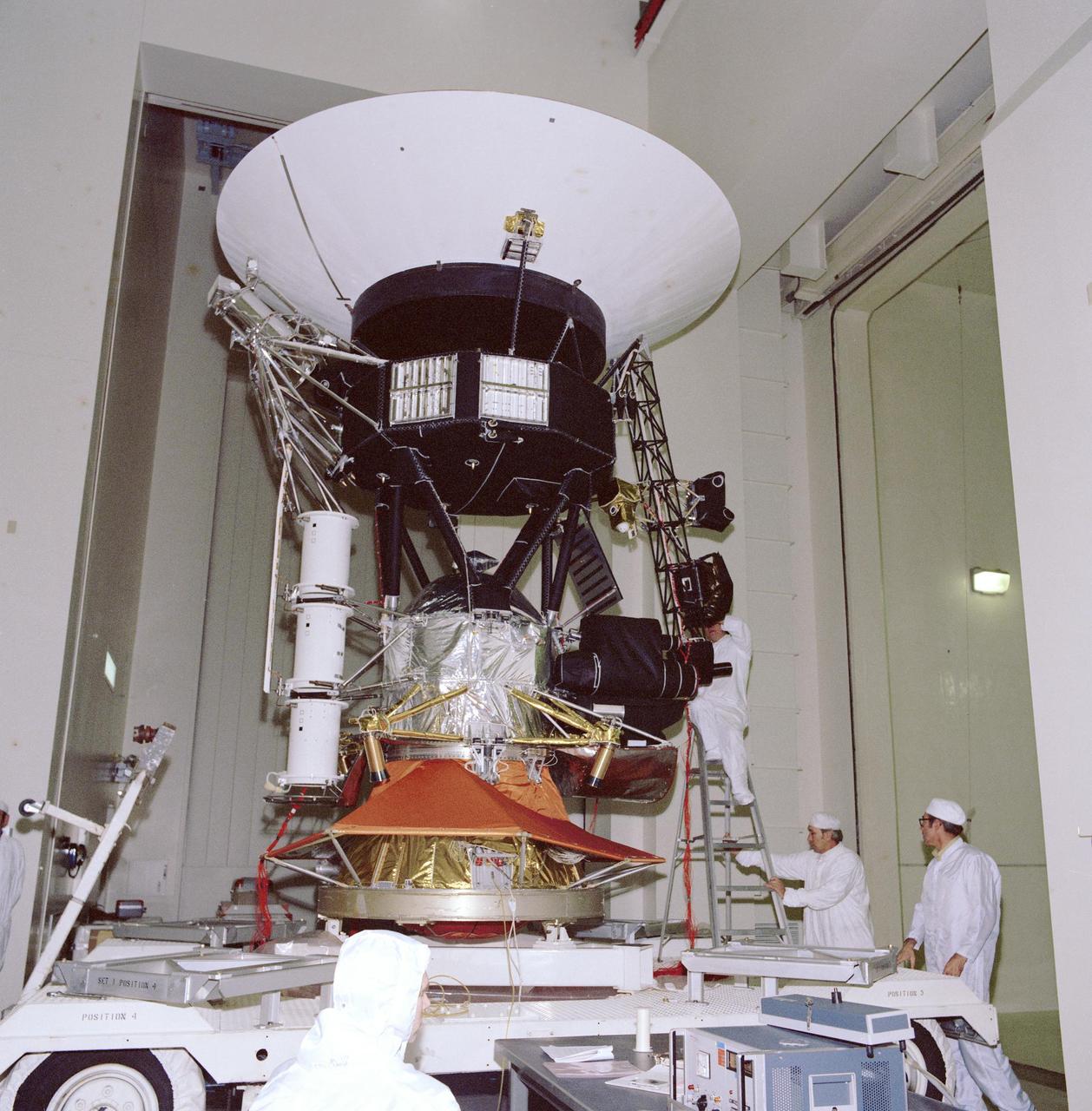 This archival photo shows engineers working on vibration acoustics and pyro shock testing of NASA's Voyager on November 18, 1976.  https://photojournal.jpl.nasa.gov/catalog/PIA21732