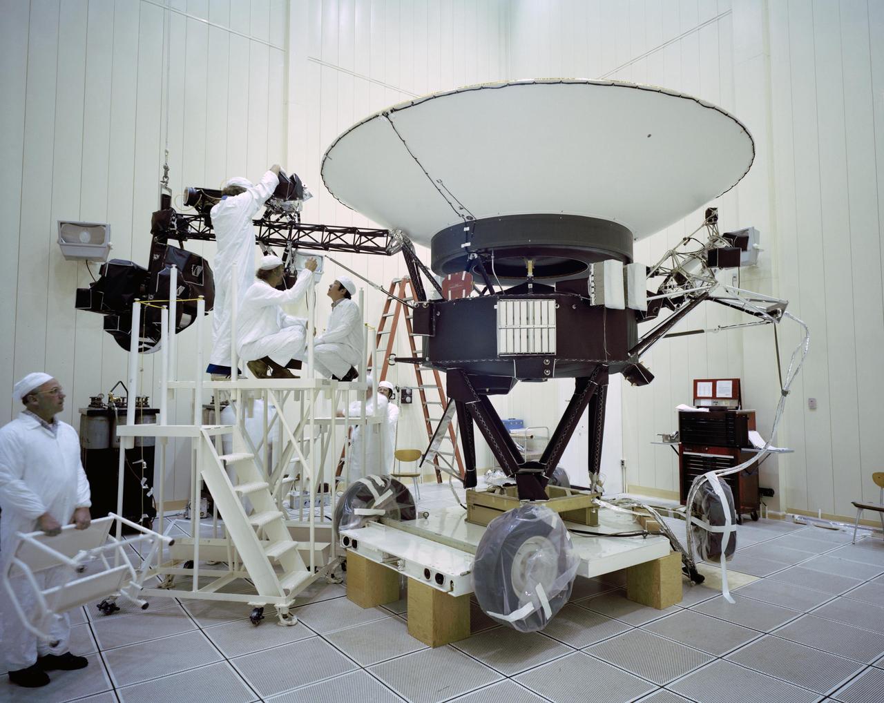 This archival photo shows engineers working on NASA's Voyager 2 spacecraft on March 23, 1977. https://photojournal.jpl.nasa.gov/catalog/PIA21736
