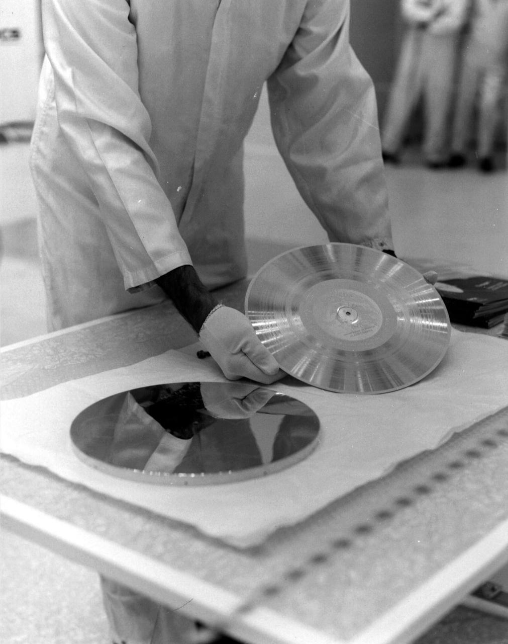The Voyager 1 Golden Record is prepared for installation on the spacecraft in this archival image from 1977.  https://photojournal.jpl.nasa.gov/catalog/PIA21741