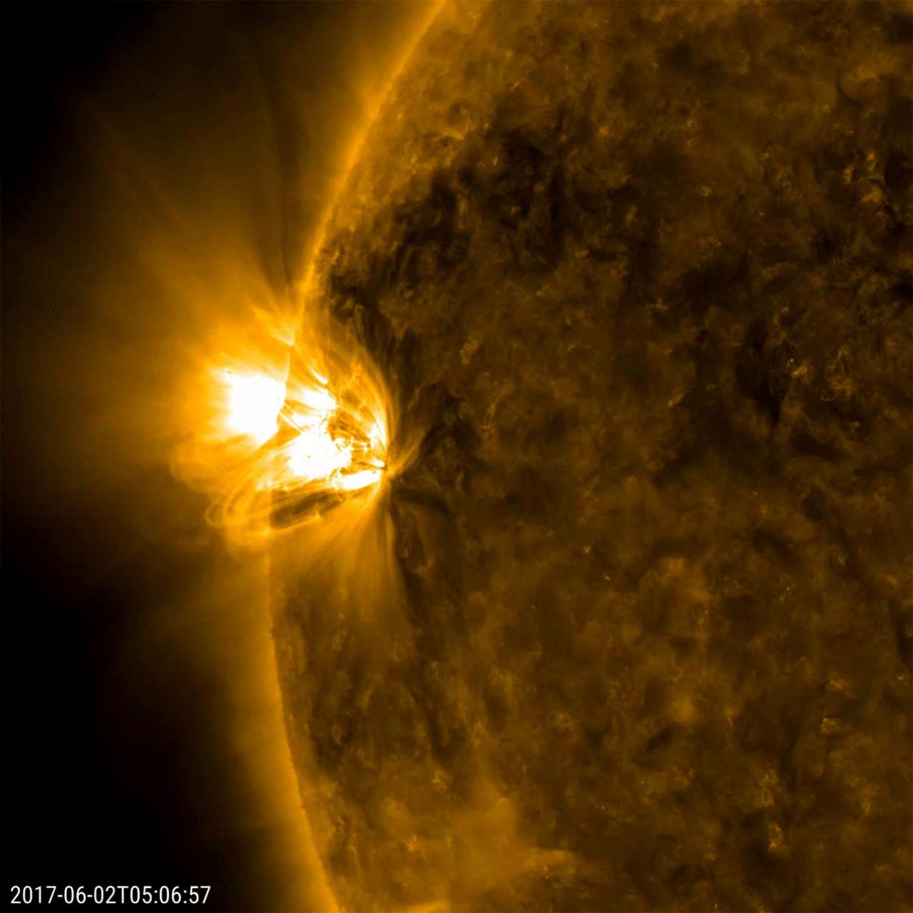 A pair of relatively small (but frenetic) active regions rotated into view, spouting off numerous small flares and sweeping loops of plasma (May 31-June 2, 2017). At first, only the one active region was observed, but mid-way though the video clip a second one behind the first can be picked out. The dynamic regions were easily the most remarkable areas on the sun during this 42-hour period. The images were taken in a wavelength of extreme ultraviolet light.  Movies are available at https://photojournal.jpl.nasa.gov/catalog/PIA21756