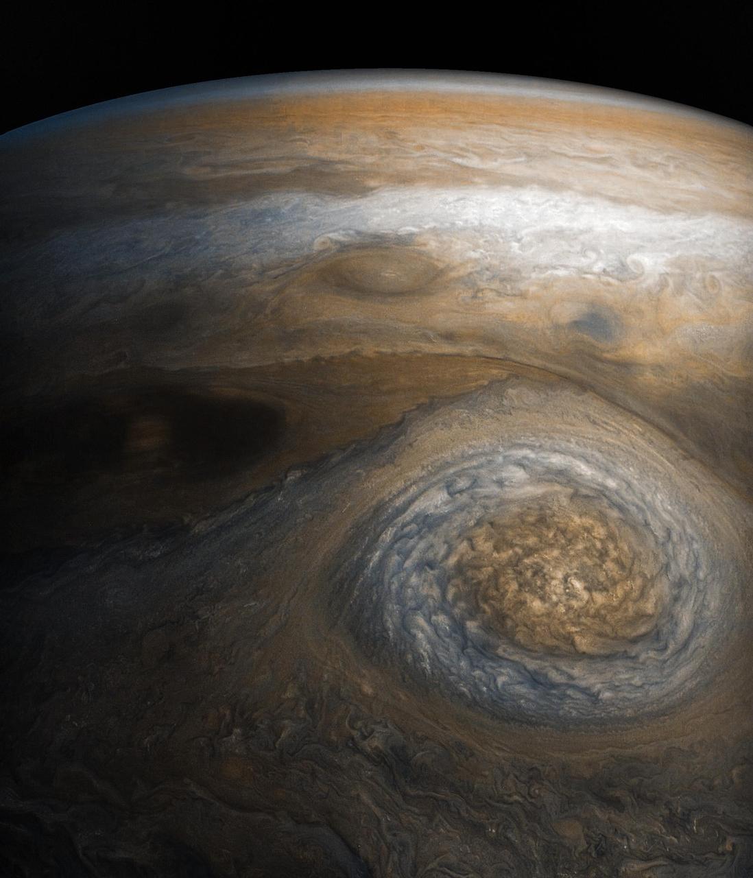 A dynamic storm at the southern edge of Jupiter's northern polar region dominates this Jovian cloudscape, courtesy of NASA's Juno spacecraft. This storm is a long-lived anticyclonic oval named North North Temperate Little Red Spot 1 (NN-LRS-1); it has been tracked at least since 1993, and may be older still. An anticyclone is a weather phenomenon where winds around the storm flow in the direction opposite to that of the flow around a region of low pressure. It is the third largest anticyclonic oval on the planet, typically around 3,700 miles (6,000 kilometers) long. The color varies between red and off-white (as it is now), but this JunoCam image shows that it still has a pale reddish core within the radius of maximum wind speeds. Citizen scientists Gerald Eichstädt and Seán Doran processed this image using data from the JunoCam imager. The image has been rotated so that the top of the image is actually the equatorial regions while the bottom of the image is of the northern polar regions of the planet. The image was taken on July 10, 2017 at 6:42 p.m. PDT (9:42 p.m. EDT), as the Juno spacecraft performed its seventh close flyby of Jupiter. At the time the image was taken, the spacecraft was about 7,111 miles (11,444 kilometers) from the tops of the clouds of the planet at a latitude of 44.5 degrees. https://photojournal.jpl.nasa.gov/catalog/PIA21776