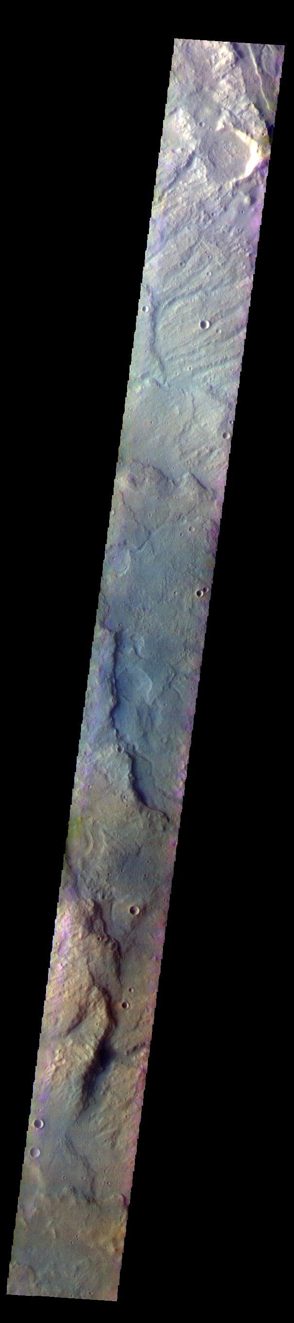 The THEMIS VIS camera contains 5 filters. The data from different filters can be combined in multiple ways to create a false color image. These false color images may reveal subtle variations of the surface not easily identified in a single band image. Today's false color image shows part of the plains and highlands of Terra Sirenum.  Orbit Number: 59752 Latitude: -37.1173 Longitude: 228.666 Instrument: VIS Captured: 2015-06-03 16:39  https://photojournal.jpl.nasa.gov/catalog/PIA21786
