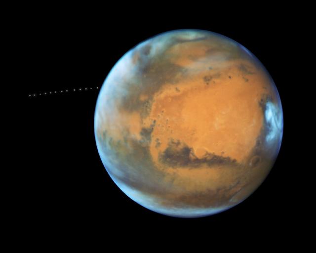 NASA image: NASA's Hubble Sees Martian Moon Orbiting the Red Planet