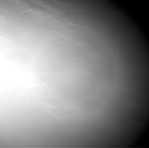 Wispy clouds float across the Martian sky in this accelerated sequence of images from NASA's Curiosity Mars rover.  The rover's Navigation Camera (Navcam) took these eight images over a span of four minutes early in the morning of the mission's 1,758th Martian day, or sol (July 17, 2017), aiming nearly straight overhead. This sequence uses raw images, which include a bright ring around the center of the frame that is an artifact of sunlight striking the camera lens even though the Sun is not in the shot. A processed version removing that artifact and emphasizing changes between images is also available.  The clouds resemble Earth's cirrus clouds, which are ice crystals at high altitudes. These Martian clouds are likely composed of crystals of water ice that condense onto dust grains in the cold Martian atmosphere. Cirrus wisps appear as ice crystals fall and evaporate in patterns known as "fall streaks" or "mare's tails." Such patterns have been seen before at high latitudes on Mars, for instance by the Phoenix Mars Lander in 2008, and seasonally nearer the equator, for instance by the Opportunity rover. However, Curiosity has not previously observed such clouds so clearly visible from the rover's study area about five degrees south of the equator.  The Hubble Space Telescope and spacecraft orbiting Mars have observed a band of clouds to appear near the Martian equator around the time of the Martian year when the planet is farthest from the Sun. With a more elliptical orbit than Earth's, Mars experiences more annual variation than Earth in its distance from the Sun. The most distant point in an orbit around the Sun is called the aphelion. The near-equatorial Martian cloud pattern observed at that time of year is called the "aphelion cloud belt." These new images from Curiosity were taken about two months before aphelion, but the morning clouds observed may be an early stage of the aphelion cloud belt.   An animation is available at https://photojournal.jpl.nasa.gov/catalog/PIA21842