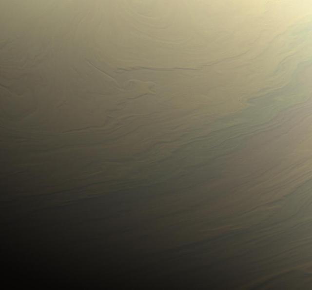 NASA's Cassini spacecraft gazed toward the northern hemisphere of Saturn to spy subtle, multi-hued bands in the clouds there.  This view looks toward the terminator -- the dividing line between night and day -- at lower left. The sun shines at low angles along this boundary, in places highlighting vertical structure in the clouds. Some vertical relief is apparent in this view, with higher clouds casting shadows over those at lower altitude.  Images taken with the Cassini spacecraft narrow-angle camera using red, green and blue spectral filters were combined to create this natural-color view. The images were acquired on Aug. 31, 2017, at a distance of approximately 700,000 miles (1.1 million kilometers) from Saturn. Image scale is about 4 miles (6 kilometers) per pixel.  https://photojournal.jpl.nasa.gov/catalog/PIA21888