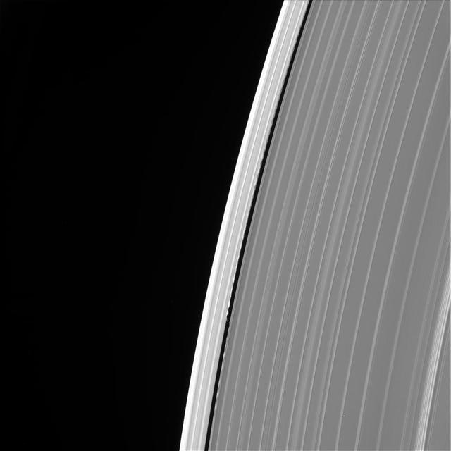 This image of Saturn's outer A ring features the small moon Daphnis and the waves it raises in the edges of the Keeler Gap. The image was taken by NASA's Cassini spacecraft on Sept. 13, 2017. It is among the last images Cassini sent back to Earth. The view was taken in visible light using the Cassini spacecraft wide-angle camera at a distance of 486,000 miles (782,000 kilometers) from Saturn. Image scale is 2.7 miles (4.3 kilometers). https://photojournal.jpl.nasa.gov/catalog/PIA21893