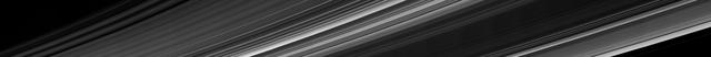 Cassini obtained this panoramic view of Saturn's rings on Sept. 9, 2017, just minutes after it passed through the ring plane. The view looks upward at the southern face of the rings from a vantage point above Saturn's southern hemisphere. The entirety of the main rings can be seen here, but due to the low viewing angle, the rings appear extremely foreshortened. The C ring, with its sharp, bright plateaus (see PIA20529), appears at left; the B ring is the darkened region stretching from bottom center toward upper right; the A ring is seen at far right. This view shows the rings' unilluminated face, where sunlight filters through from the other side. The Cassini spacecraft ended its mission on Sept. 15, 2017. https://photojournal.jpl.nasa.gov/catalog/PIA21898