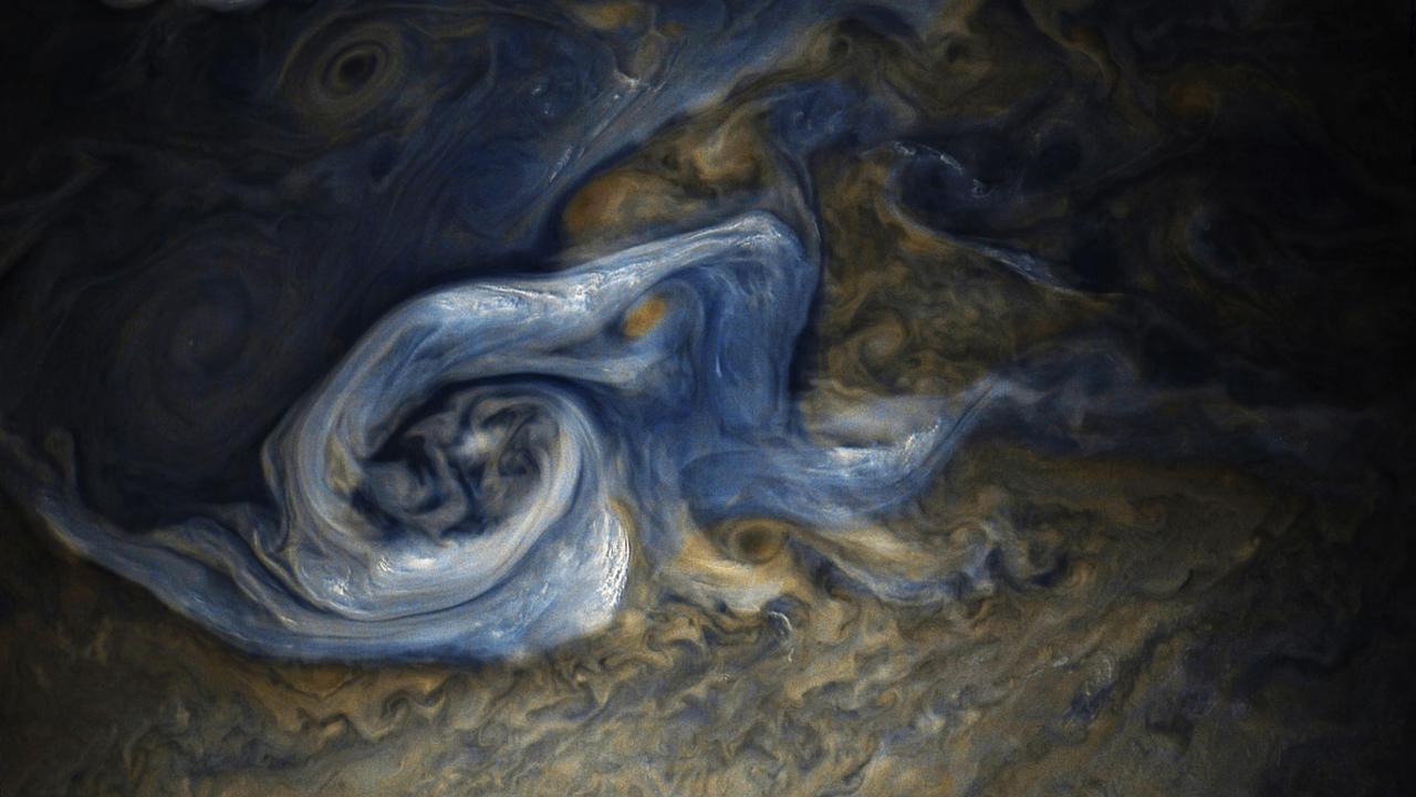 This color-enhanced image of a massive, raging storm in Jupiter's northern hemisphere was captured by NASA's Juno spacecraft during its ninth close flyby of the gas giant planet. The image was taken on Oct. 24, 2017 at 10:32 a.m. PDT (1:32 p.m. EDT). At the time the image was taken, the spacecraft was about 6,281 miles (10,108 kilometers) from the tops of the clouds of Jupiter at a latitude of 41.84 degrees. The spatial scale in this image is 4.2 miles/pixel (6.7 kilometers/pixel). The storm is rotating counter-clockwise with a wide range of cloud altitudes. The darker clouds are expected to be deeper in the atmosphere than the brightest clouds. Within some of the bright "arms" of this storm, smaller clouds and banks of clouds can be seen, some of which are casting shadows to the right side of this picture (sunlight is coming from the left). The bright clouds and their shadows range from approximately 4 to 8 miles (7 to 12 kilometers) in both widths and lengths. These appear similar to the small clouds in other bright regions Juno has detected and are expected to be updrafts of ammonia ice crystals possibly mixed with water ice. Citizen scientists Gerald Eichstädt and Seán Doran processed this image using data from the JunoCam imager. https://photojournal.jpl.nasa.gov/catalog/PIA21971
