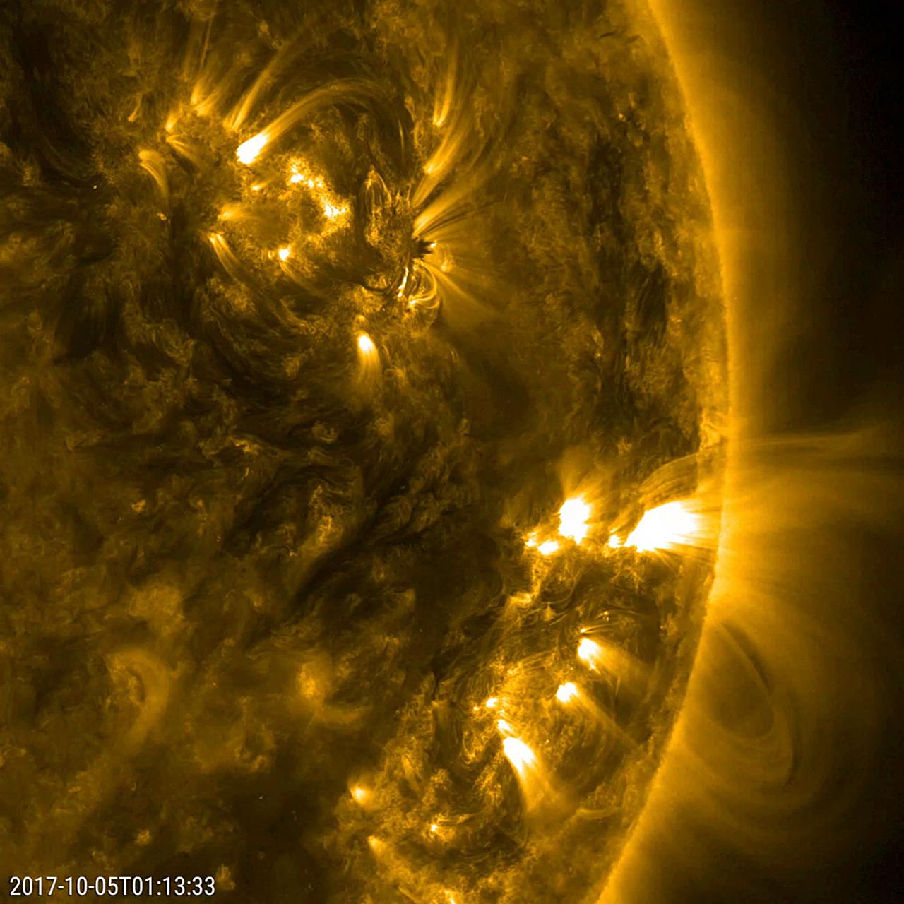 This close-up video clip shows a pair of active regions (the brighter areas) move and change as they rotate with the sun over just a 17-hour period (Oct. 4-5, 2017). They were observed in a wavelength of extreme ultraviolet light that reveals plasma heated to over a million degrees. The arches above the regions consist of charge particles spinning along and revealing magnetic field lines. Each one shows a few minor bursts of material none of them were serious.  Animations are available at https://photojournal.jpl.nasa.gov/catalog/PIA22039