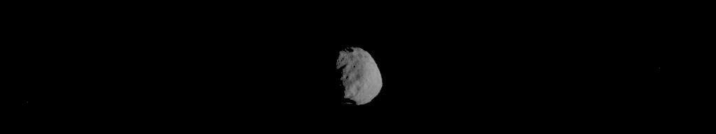 This image of Phobos is one product of the first pointing at that Martian moon by the Thermal Emission Imaging System (THEMIS) camera on NASA's Mars Odyssey orbiter. The Sept. 29, 2017, observation also provided information about temperatures on different areas of Phobos.  Researchers have been using THEMIS to examine Mars since early 2002, but the maneuver turning the orbiter around to point the camera at Phobos was developed only recently.  Phobos has an oblong shape with average diameter of about 14 miles (22 kilometers). Odyssey orbits Mars at an altitude of about 250 miles (400 kilometers), much closer to the planet than to Phobos, which orbits about 3,700 miles (6,000 kilometers) above the surface of Mars. The distance to Phobos from Odyssey during this observation was about 3,424 miles (5,511 kilometers).  https://photojournal.jpl.nasa.gov/catalog/PIA22056