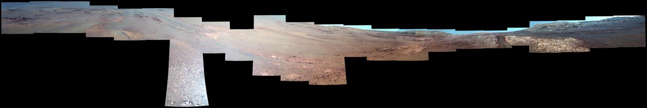 This enhanced-color view from within "Perseverance Valley," on the inner slope of the western rim of Endurance Crater on Mars, includes wheel tracks from the Opportunity rover's descent of the valley. The Panoramic Camera (Pancam) on Opportunity's mast took the component images of the scene during the period Sept. 4 through Oct. 6, 2017, corresponding to sols (Martian days) 4840 through 4871 of the rover's work on Mars.  Perseverance Valley is a system of shallow troughs descending eastward about the length of two football fields from the crest of the crater rim to the floor of the crater. This panorama spans from northeast on the left to northwest on the right, including portions of the crater floor (eastward) in the left half and of the rim (westward) in the right half. Opportunity began descending Perseverance Valley in mid-2017 (see map) as part of an investigation into how the valley formed.  Rover wheel tracks are darker brown, between two patches of bright bedrock, receding toward the horizon in the right half of the scene.  This view combines multiple images taken through three different Pancam filters. The selected filters admit light centered on wavelengths of 753 nanometers (near-infrared), 535 nanometers (green) and 432 nanometers (violet). The three color bands are combined here with enhancement to make differences in surface materials easier to see.  A map and full-resolution TIFF file are available at https://photojournal.jpl.nasa.gov/catalog/PIA22073