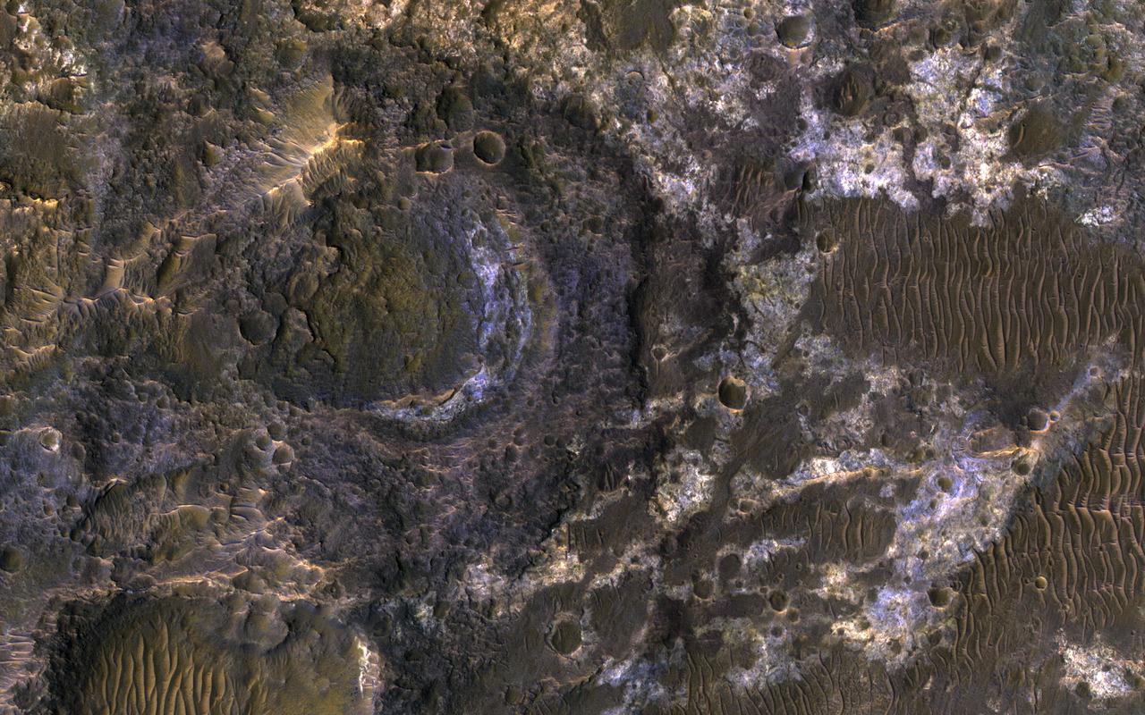 Ladon Basin was a large impact structure that was filled in by the deposits from Ladon Valles, a major ancient river on Mars as seen in this image from NASA's Mars Reconnaissance Orbiter (MRO).  These wet sediments were altered into minerals such as various clay minerals. Clays imply chemistry that may have been favorable for life on ancient Mars, if anything lived there, so this could be a good spot for future exploration by rovers and perhaps return of samples to Earth.  The map is projected here at a scale of 50 centimeters (19.7 inches) per pixel. [The original image scale is 52.1 centimeters (20.5 inches) per pixel (with 2 x 2 binning); objects on the order of 156 centimeters (61.4 inches) across are resolved.] North is up.  https://photojournal.jpl.nasa.gov/catalog/PIA22183