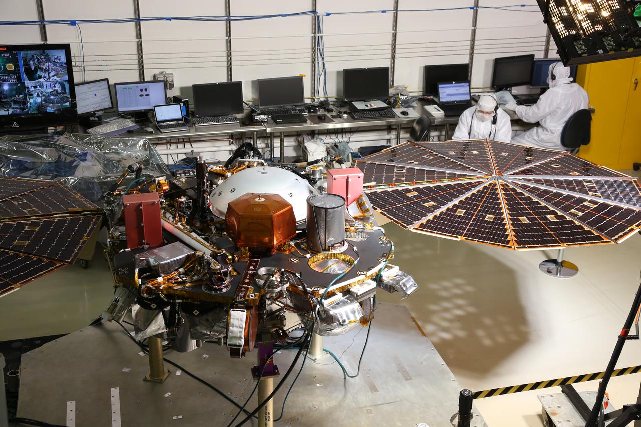 While in the landed configuration for the last time before arriving on Mars, NASA's InSight lander was commanded to deploy its solar arrays to test and verify the exact process that it will use on the surface of the Red Planet. During the test on Jan. 23, 2018 from the Lockheed Martin clean room in Littleton, Colorado, engineers and technicians evaluated that the solar arrays fully deployed and conducted an illumination test to confirm that the solar cells were collecting power.  A video is available at https://photojournal.jpl.nasa.gov/catalog/PIA22202