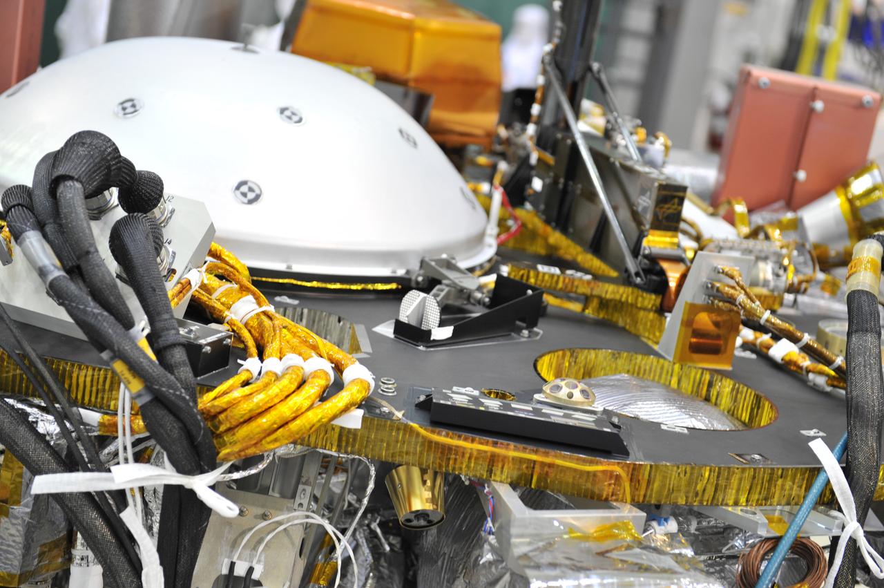 Technicians at Lockheed Martin Space in Littleton, Colorado installed a microchip with 1.6 million names submitted by the public to ride along with NASA's InSight mission to Mars. The chip was installed on Jan. 23, 2018. This joins another microchip that was previously installed that included 800,000 names for a grand total of 2.4 million names going to Mars as early as May 5, 2018. The microchip including names from the NASA InSight mission's "Send Your Name to Mars" campaign was affixed to the spacecraft with a special glue. https://photojournal.jpl.nasa.gov/catalog/PIA22206
