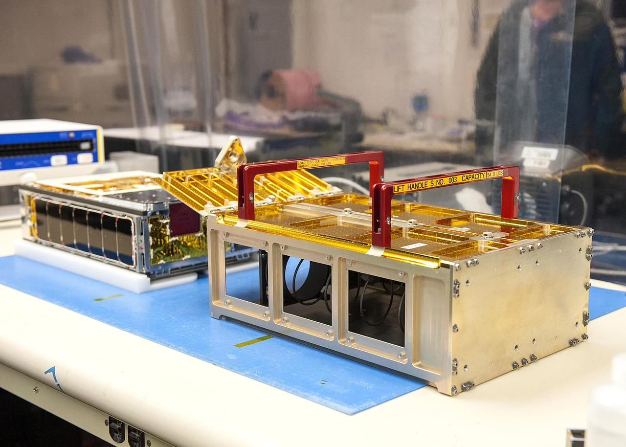 One of the MarCO CubeSats inside a cleanroom at Cal Poly San Luis Obispo, before being placed into its deployment box. The deployment box will eject the briefcase-sized CubeSat into space after launch. It and its twin will accompany the InSight Mars lander when it lifts off from Vandenberg Air Force Base in May.  https://photojournal.jpl.nasa.gov/catalog/PIA22322