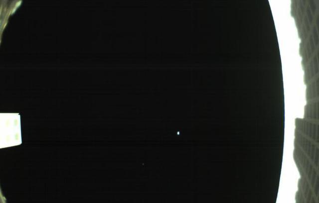 The first image captured by one of NASA's Mars Cube One (MarCO) CubeSats. The image, which shows both the CubeSat's unfolded high-gain antenna at right and the Earth and its moon in the center, was acquired by MarCO-B on May 9.  MarCO is a pair of small spacecraft accompanying NASA's InSight (Interior Investigations Using Seismic Investigations, Geodesy and Heat Transport) lander. Together, MarCO-A and MarCO-B are the first CubeSats ever sent to deep space. InSight is the first mission to ever explore Mars' deep interior.  If the MarCO CubeSats make the entire journey to Mars, they will attempt to relay data about InSight back to Earth as the lander enters the Martian atmosphere and lands. MarCO will not collect any science, but are intended purely as a technology demonstration. They could serve as a pathfinder for future CubeSat missions.  An annotated version is available at https://photojournal.jpl.nasa.gov/catalog/PIA22323