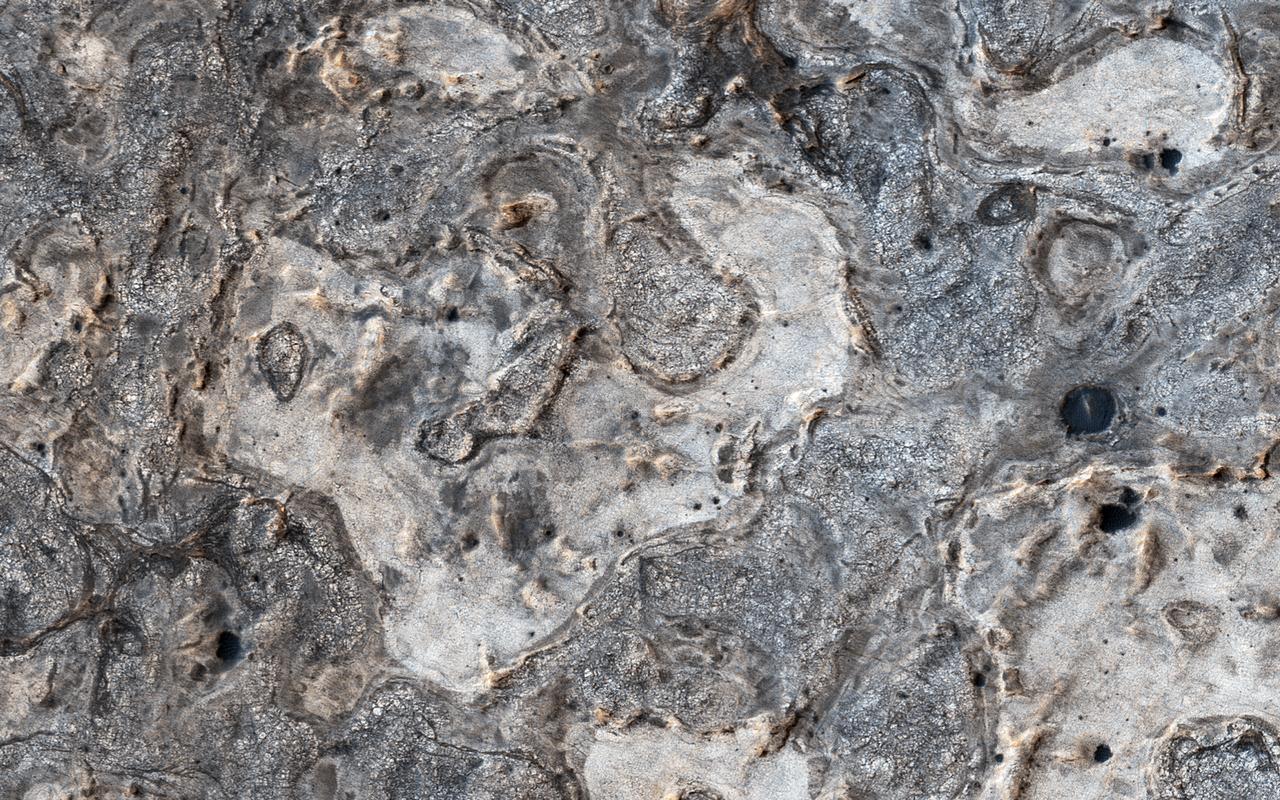 NASA's Opportunity rover has spent 13 years exploring a small region of Meridiani Planum which has a rather ordinary appearance as seen by NASA's Mars Reconnaissance Orbiter (MRO). Other portions of Meridiani are much more interesting, with well-exposed layered bedrock eroded into strange patterns. For more information see https://photojournal.jpl.nasa.gov/catalog/PIA22438