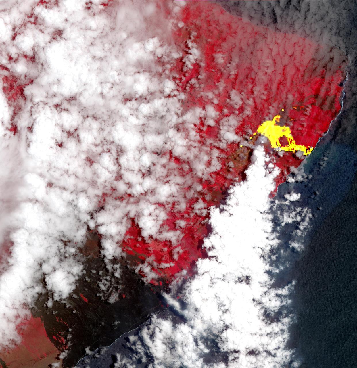 Hawaii's Kilauea's eruption, which began three weeks ago, has produced new lava flows that reached the ocean. The combination of molten lava and sea water produced clouds of noxious gases, such as hydrogen sulfide. In this image from the Advanced Spaceborne Thermal Emission and Reflection (ASTER) radiometer instrument on NASA's Terra satellite, vegetation is displayed in red, clouds are white and the hot lava flows, detected by ASTER's thermal infrared channels, are overlaid in yellow. The image was acquired May 22, 2018, covers an area of 20.3 by 20.9 miles (32.6 by 33.6 kilometers), and is located at 19.6 degrees north, 154.9 degrees west.  https://photojournal.jpl.nasa.gov/catalog/PIA22459